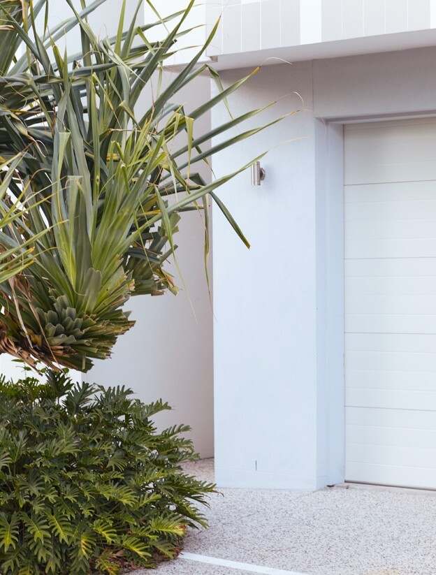 A garden bed outside of a house in a residential village on the Gold Coast.