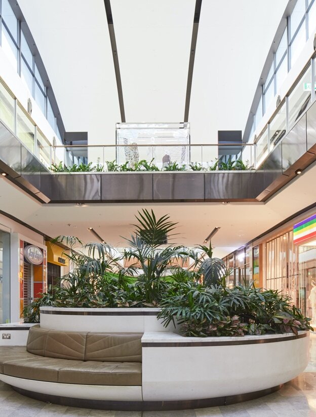 An indoor garden built into seating at Westfield shopping centre.